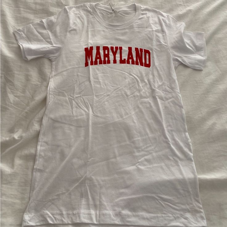 Maryland Umd Tee Shirt Size Small. New Without Tags Never Worn. White Summer T-shirt For College, White School Spirit Top For Spring, White Shirt With School Spirit For Spring, White College Style T-shirt With Letter Print, White College Style T-shirt With Text Print, White Cotton College T-shirt, White Cotton T-shirt In College Style, White T-shirt With School Spirit For Summer, White School Spirit T-shirt For Summer