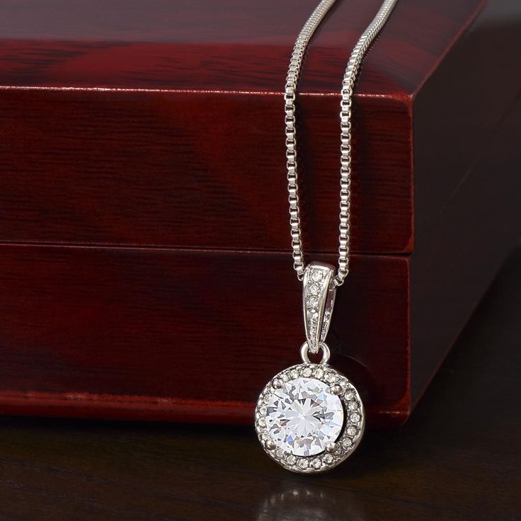 Surprise your loved one with a timeless and elegant gift. Our dazzling Eternal Hope Necklace features a center cushion cut cubic zirconia that will sparkle with every step. The center crystal is adorned with equally brilliant CZ crystals, ensuring a stunning look every wear. Wow her by gifting her an accessory that will pair with everything in her wardrobe! 14k white gold finish over stainless steel 8mm center cushion-cut cubic zirconia crystal 1.2mm accent CZ crystals Pendant dimensions: 0.6" ( Crystals Pendant, Surprise Your Girlfriend, Promise Necklace, Wife Necklace, Hope Necklace, Halo Pendant, Solitaire Necklaces, White Gold Necklaces, Crystal Necklace Pendant