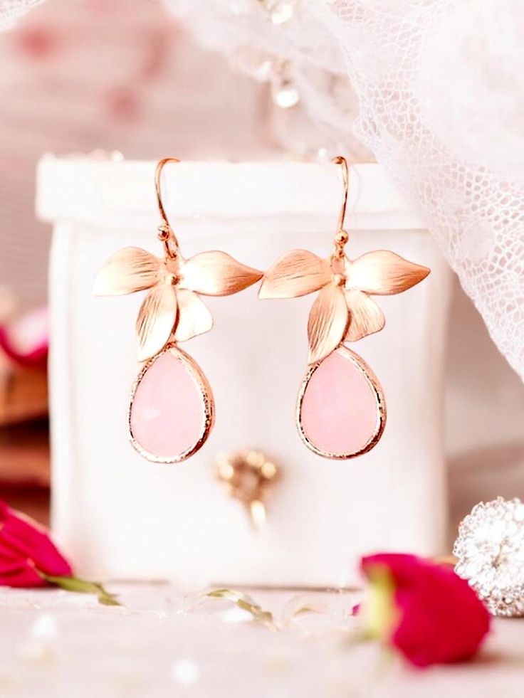 These Blush Pink Opal Rose Gold Earrings are the perfect addition to any jewelry collection. With their delicate floral design and stunning opal gemstones, they make a beautiful and unique piece of personalized jewelry for her. Ideal for gifting, these earrings are an excellent choice for birthdays, anniversaries, or as a thank-you gift. Opal Gemstone: The elegant blush pink opals add a touch of sophistication to these earrings. Rose Gold: The rose gold finish provides an on-trend look that comp Rose Gold Ear Wire Earrings For Party, Dainty Rose Gold Earrings For Party, Rose Gold Drop Earrings For Bridal Gift, Valentine's Day Wedding Flower Earrings, Mother's Day Party Flower Earrings, Elegant Pink Teardrop Flower Earrings, Delicate Rose Gold Earrings For Party, Delicate Pink Gold Earrings As Gift, Delicate Rose Gold Party Earrings