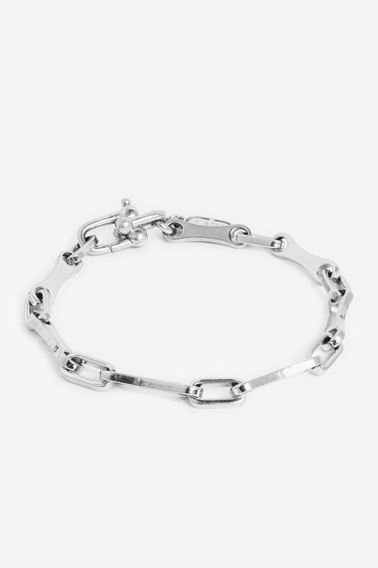 Titania is our slimmest and most charming chain. Perfect for stacking or wearing alone, this bracelet adds simplicity and timeless elegance to any look. Material: Stainless Steel Sterling Silver Delicate Chain Bracelet For Everyday, Everyday Sterling Silver Delicate Chain Bracelet, Timeless Silver Bracelets With Rectangular Links, Everyday Silver Link Chain Bracelet, Minimalist Oval Link Bracelet For Formal Occasions, Minimalist Formal Oval Link Bracelet, Classic Adjustable Bracelet With Delicate Chain, Classic Chain Bracelet With Solid Link Construction, Silver Oval Link Bracelets For Everyday