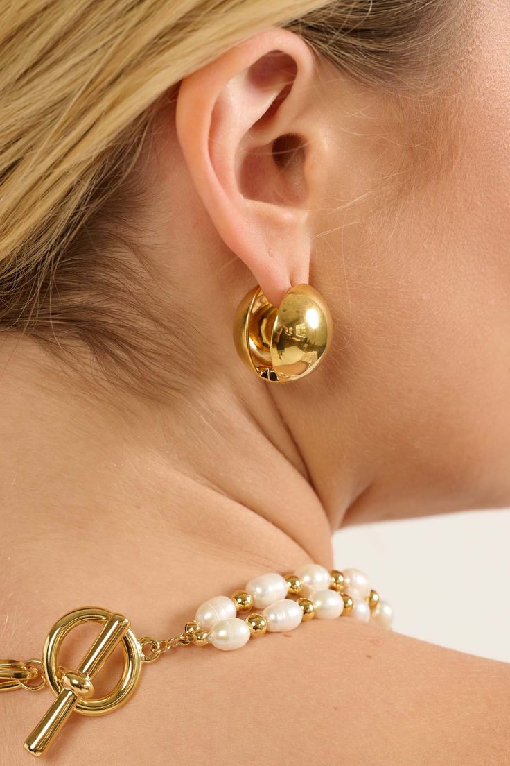 Spherical huggie hoop earrings. Hinge closure. Gold-plated brass. .75 inches in diameter. Imported. All jewelry sales are final. Everyday Metal Hoop Clip-on Earrings, Everyday Small Hoop Hinged Earrings, Everyday Small Hoop Hinged Jewelry, Clip-on Metal Huggie Earrings, Gold-tone Huggie Hoop Earring, Formal Metal Huggie Jewelry, Small Brass Hoop Earrings For Formal Occasions, Gold-tone Single Huggie Hoop Earring, Everyday Small Hoop Metal Clip-on Earrings