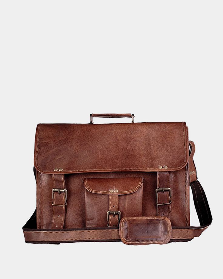 A Timeless Style that Never Goes Out of Fashion THE VINTAGE LEATHER BAG IS THE ULTIMATE IN CLASSIC LEATHER MESSENGERS Made from the finest quality leather available, this vintage leather briefcase is passionately handcrafted by the most skilled artisans. Looking for a stylish vintage leather satchel with a ton of storage space? You can easily fit a 15.6 inch laptop, and there's loads more room for your tablets, files, documents, cables, chargers, books, pens and just about anything else the student or professional needs to carry. Features Made from full grain leather High-quality hardware and concealed locks safely secure the bag Durable adjustable leather carrying strap can be disconnected One outer pocket, one zipper pocket at the back, plus lockable compartments inside for computer acce Vintage Leather Backpack With Rectangular Shape, Vintage Leather Backpack With Leather Lining, Vintage Rectangular Leather Backpack, Vintage Leather Lined Laptop Bag For Travel, Vintage Brown Leather Briefcase, Rectangular, Vintage Rectangular Laptop Bag For Formal Use, Vintage Brown Leather Satchel Backpack, Vintage Soft Leather Satchel Backpack, Vintage Brown Laptop Bag With Leather Handles