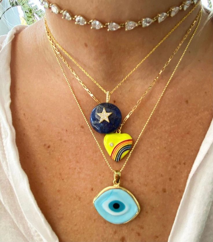 Carry a little extra sunshine right 'round your neck with our latest energizing charm! Our Rainbows in Your Heart Pendant is bound to make you smile with its gold-trimmed arc of colors flanked by a solitaire crystal on lively yellow enamel. Pop it on to give your fit a fresh, free-spirited finishing touch. Pendant: 0.7" wide, 0.6" height 16" chain length Yellow Gold Enamel Round Pendant Charm Necklace, Blue Heart Charm Necklaces, Everyday Rainbow Round Jewelry, Yellow Enamel Round Jewelry, Blue Heart Charm Necklace, Rainbow Enamel Jewelry As Gift, Rainbow Enamel Jewelry For Gifts, Rainbow Enamel Jewelry For Gift, Rainbow Enamel Jewelry Gift