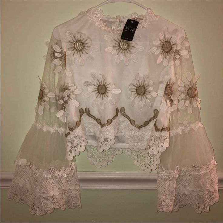 Brand New White Blouse With Gold And White Flower Appliqu On It. Super Cute And Fancy Summer Long Sleeve Lace Top With Floral Embroidery, Summer Floral Embroidered Long Sleeve Lace Top, White Long Sleeve Blouse With Floral Applique, Bohemian Lace Top With Floral Print, Long Sleeve Lace Top For Summer Party, Feminine Lace Top For Spring Party, Chic Fitted Blouse For Garden Party, Feminine Spring Lace Top For Party, Feminine Lace Top For Spring Brunch