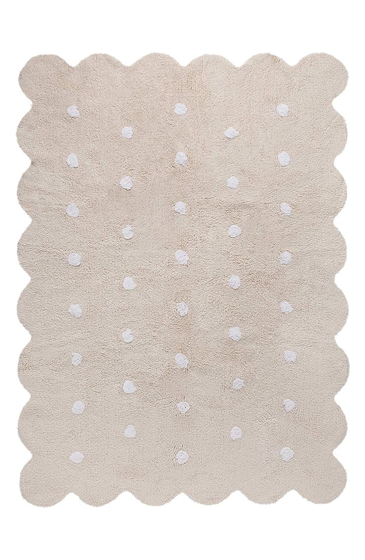 a white rug with polka dots on it