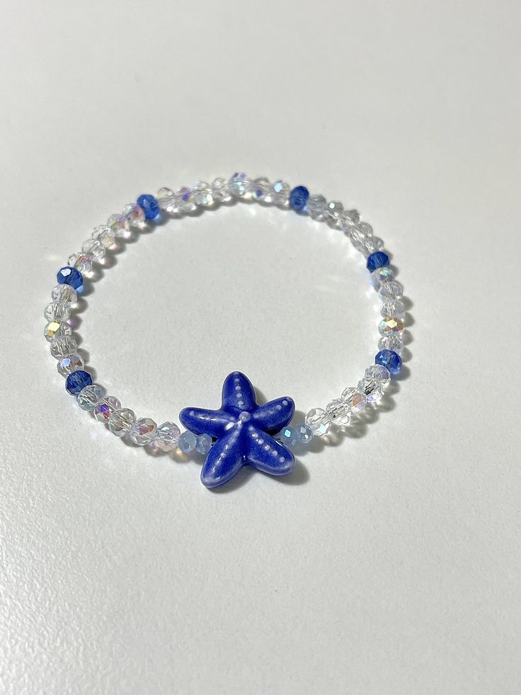 This will come with the pattern and color beads in the picture, and a blue starfish.                                                  * NOTE:*                         The bracelet in the picture is 6.5 inches.                         If you pick a different size the pattern           of beads in the back will be slightly different.  ANY QUESTIONS AT ALL OR CUSTOM ORDERS PLEASE DON'T HESITATE TO MESSAGE ME I WILL GET BACK TO YOU ASAP! -Please roll-on bracelets to avoid   over-stretching. -As with Cheap Ocean-inspired Beaded Bracelets For Gift, Cheap Ocean-inspired Beaded Bracelet, Beachy Bracelets Beads, Cheap Blue Bracelets With Starfish Charm, Adjustable Blue Jewelry With Starfish Charm, Adjustable Blue Starfish Jewelry, Blue Bracelet With Starfish Charm And Round Beads, Blue Bracelets With Starfish Charm And Round Beads, Blue Starfish-shaped Beaded Bracelets As Gift