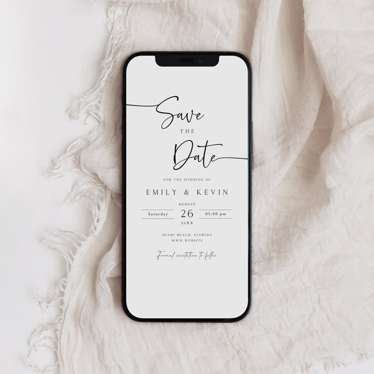 an iphone case sitting on top of a white blanket with the words save the date printed on it