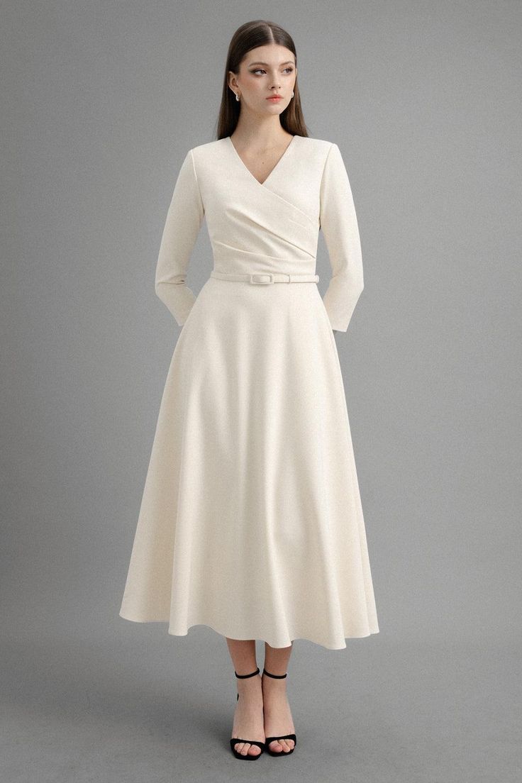 Classic V-neck Semi-formal Dress, Formal Cotton A-line Midi Dress, Elegant V-neck Dress With Surplice Neckline For Fall, White V-neck Midi Dress For Formal Occasions, Elegant Cream A-line Maxi Dress, Formal Cream A-line Maxi Dress, Cream A-line Dress For Work, V-neck Fit And Flare Midi Dress For Work, Cream V-neck Dress For Fall