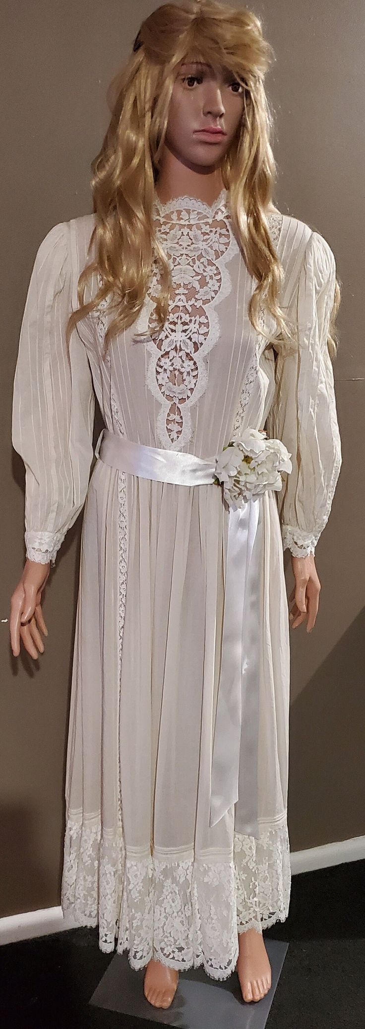 This very pretty wedding dress was hand-made in 1988.  It features a high collar with a gorgeous lace panel in the bodice, beading fasteners at the back and comes with the original waist band.  Also included is the original slip dress which fastens at the back with a zipper and is the same color as the outer dress layer.  Measurements:  Bust : 35' Waist: 30'  Hip: 40' Vintage Lace Wedding Dress For Debutante Ball, Regency Style Wedding Dress With Lace Collar, Regency Style Victorian Dress With Lace Collar For Wedding, Vintage White Wedding Dress With Lace Trim, Vintage White Gown For Debutante Ball, Regency Style Wedding Gown With Lace Trim, White Vintage Wedding Dress For Ceremony, Vintage Wedding Night Dress With Lace Work, Vintage Lace Dresses For Wedding Night