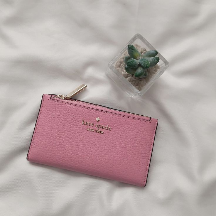 Nwt Kate Spade Leila Small Slim Leather Bifold Wallet Bright Carnation Wlr00395 $159 Details 3.1" H X 5.5 W X 0.9" D Pebbled Leather Metal Pinmount With Spade Logo Two Way Spade Jacquard Lining 5 Credit Card Slots, Id Window, 2 Slip Pockets Exterior Top Zip Coin Compartment On Front Of Wallet Snap Closure Dust Bag Not Included Elegant Pink Leather Coin Purse, Luxury Pink Bifold Wallet, Pink Clutch Wallet With Interior Card Slots, Chic Pink Wallet With Zipper Closure, Compact Pink Coin Purse For Travel, Pink Luxury Wallets For Everyday Use, Pink Feminine Wallet For Everyday Use, Feminine Pink Wallet For Everyday Use, Compact Pink Travel Coin Purse