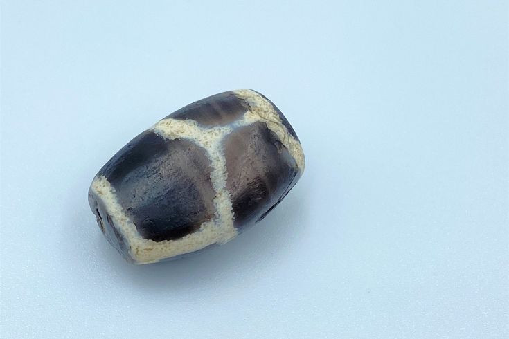 The Beautiful Himalayan Regions Attractive Rare Phum Dzi Bead With Rare Special Pattern. The Age Of This Bead Are More Than 2000 Years Old. It Was Used As Amulet Bead In Himalayan Regions and Even They Used Now Days As Well . This Bead Got Very Oily And Smooth Surface Its Because Of Long Passage Of Time Using In Prayers Malas And Necklaces. Conditions Are Clearly Shown In The Pictures Above. Fast And Free Shipping Service Enjoy. Traditional Agate Large Beads, Handmade Traditional Agate Beads, Traditional Carved Oval Beads, Traditional Oval Agate Beads, Gems, And Cabochons, Traditional Oval Agate Beads Gems And Cabochons, Traditional Agate Healing Beads, Traditional Oval Natural Stone Beads, Traditional Oval Natural Stones Beads, Traditional Oval Handmade Beads