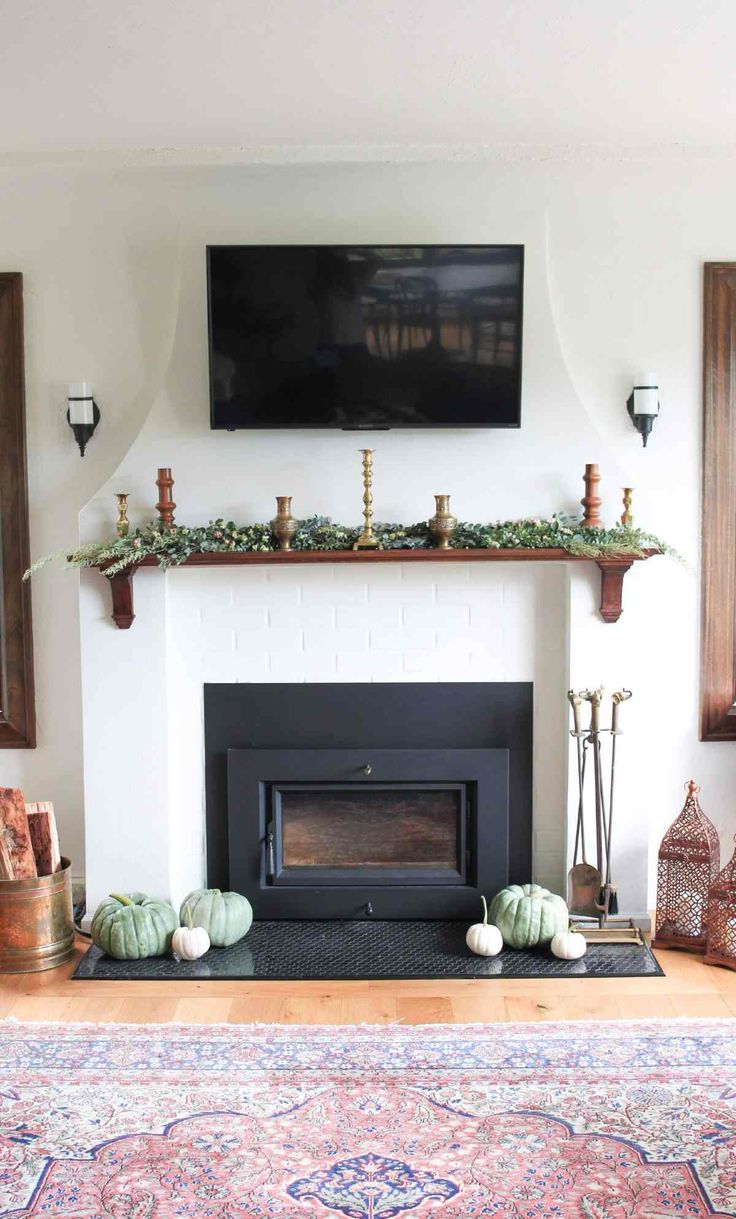 a living room with a fire place and a flat screen tv mounted above the fireplace