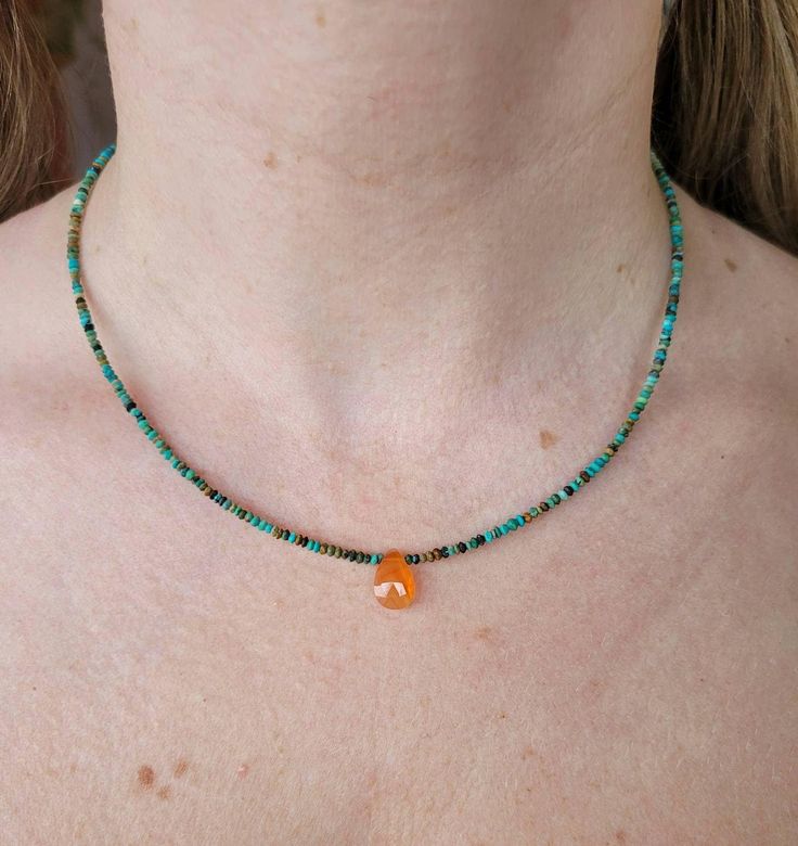 Dainty tibetan turquoise and carnelian gemstone necklace.   Rare ultra dainty beads are very hard to find and are all hand strung Available in sterling silver, gold filled or rose gold filled clasp and extension chain.  Comes with a 2 inch extension chain...so can be adjust to your perfect fit. These are real tibetan turquoise beads each one hand strung with a gorgeous faceted carnelian center bead. Any questions please reach out Handmade Agate Dangle Jewelry, 14k Gold Filled Gemstone Pendant Jewelry, Handmade Bohemian Agate Jewelry, Beaded Agate Pendant Jewelry, Spiritual Round Beads Jewelry Gift, Spiritual Round Beads Jewelry For Gift, Bohemian Agate Jewelry With Natural Stones, Minimalist Sterling Silver Amber Jewelry, Spiritual Agate Dangle Jewelry