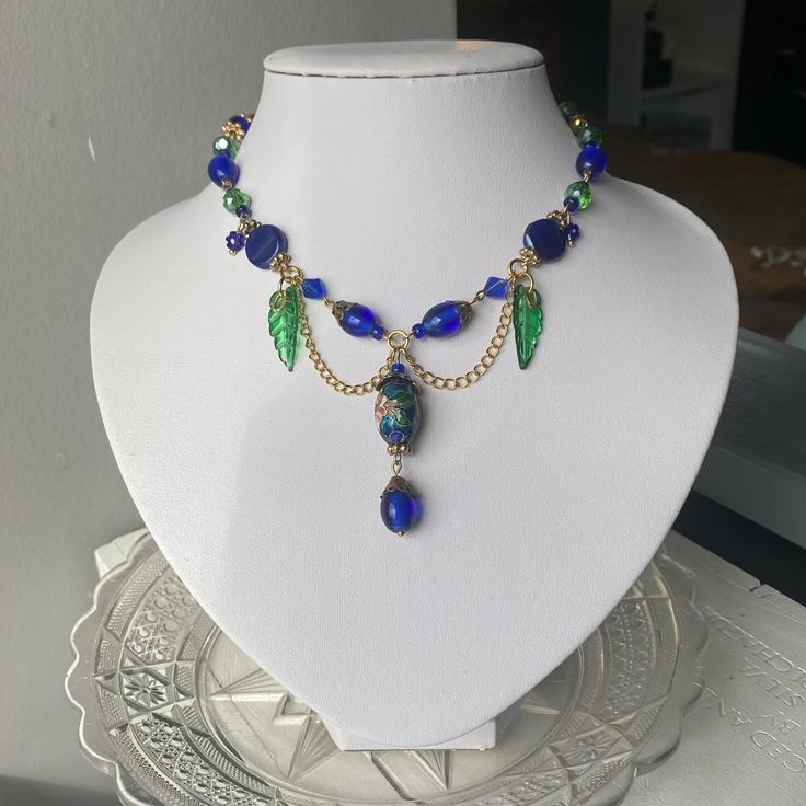 Royal blue necklace, with gold and green details! perfect for anyone looking for some princess vibes 👑 €25 - #handmadejewelry #fairycorenecklace #fairycorejewellery #fairycore #smallbusiness #y2kaesthetic #beadedjewelry #pinterestjewelry #cottagecorefashion #princesscore Royal Blue Necklace, Pinterest Jewelry, Princess Vibes, Green Details, Princess Core, Alternative Jewelry, Cottagecore Fashion, Gold And Green, Necklace Green