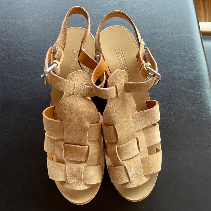 Brand New And Never Worn Ralph Lauren Collection Sandals From About 2014. Cork Wedges With Sand Color Butter Soft Suede. Buckle Adjust Ankle Strap. Leather Lined And Leather Sole. Made In Spain. Retail $550 With Tax Back Then. Size 8 1/2. Heel Measures Approx 4 Inches. Front Approx 1.75. Excellent New Condition. No Flaws. Suede Open Toe Wedge Sandals With Woven Sole, Suede Wedge Sandals With Woven Sole, Beige Suede Sandals With Woven Sole, Beach Suede Wedge Sandals With Buckle, Beach Suede Wedge Sandals With Buckle Closure, Beige Suede Wedge Heel Sandals, Natural Leather Wedge Heels, Natural Leather Closed Toe Wedge Sandals, Suede Wedge Sandals With Stacked Heel For Summer