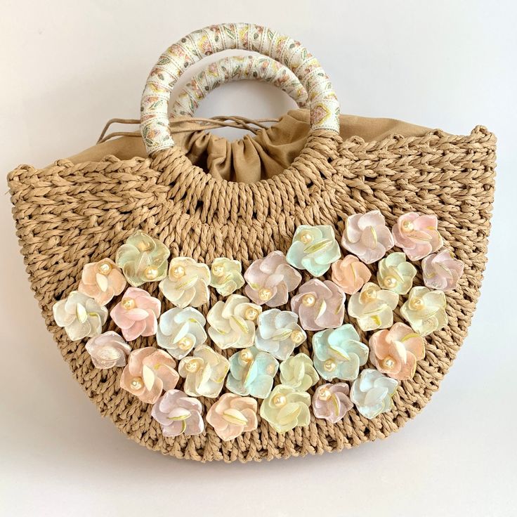 Stylish luxury straw handbag detailed with pastel hand painted seashells that have been given touches of gold for shimmer and little imitation fresh water pearl surprises. This fun  straw tote bag for summer is ready to keep your summer style game strong. The top handle is hand-wrapped in vintage fabric trim. The cotton drawstring inner lining keeps your belongings securely inside and organized. These make unique handmade gifts for women or treat yourself to this summer bag that will go with eve Summer Beige Straw Bag With Pearl Handle, Spring Cream Bag With Bamboo Handle, Gold Top Handle Straw Bag For Vacation, Cream Bags With Bamboo Handle For Spring, Natural Straw Bag With Pearl Handle For Everyday, Summer Cream Bag With Pearl Handle, Cream Bag With Pearl Handle For Summer, Gold Top Handle Straw Bag For Beach, Summer Cream Bags With Pearl Handle