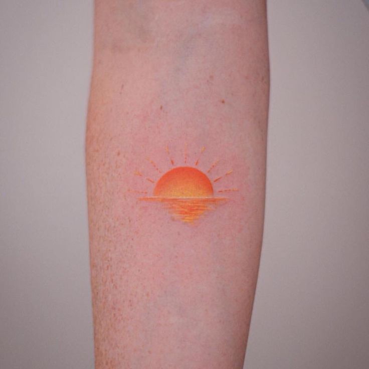 the sun is shining brightly on someone's left arm and it appears to be orange