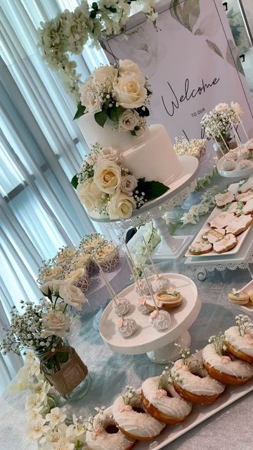 a table topped with lots of cakes and cupcakes