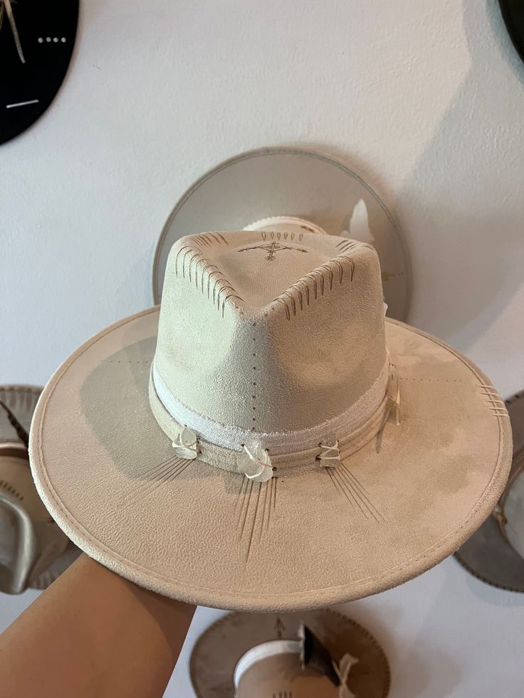 Our Fonte Tulum hats have a classic full length brim of 9 cm, wich perfectly shades the face from the summer sun. Each piece is unique due its artisanal elaboration. The magical hands of the artisans unite with the current vision of our designs. From Tulum to the world. Sizes: M: Circumference is 56-58cm and fits most head sizes. L: Circumference is 60-62cm. Both sizes include an adjustable string inside for a secure fit. Luxury Adjustable Felt Hat For Festival, Luxury White Fedora For Western-themed Events, Luxury White Brimmed Hat Bands, Cream Short Brim Sun Hat For Rodeo, Cream Sun Hat With Curved Brim For Rodeo, Country Style Wide Brim Felt Hat For Beach, Western Style Cream Flat Brim Sun Hat, Western Cream Flat Brim Sun Hat, Country Style Wide Brim Panama Hat