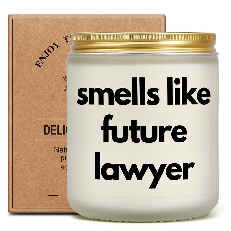 a white jar with the words smells like future lawyer on it next to a cardboard box