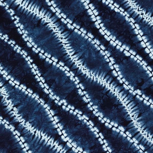 an image of a blue and white tie dye pattern that looks like something out of space