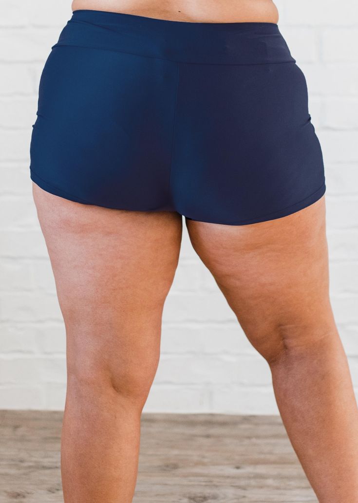 Swim ShortsFit & Sizing High waisted Wide waistband sits just below your natural waist Inseam length 2.7” (Size S) For more fit and sizing info, check out our size chart Features Quick dry Designed to be worn over our favorite bikini bottom Care Rinse in cold water to wash off any chemicals, chlorinated water or saltwater Machine wash in cold water on gentle cycle Lay flat to dry in the shade Material 82% nylon 18% spandex Gusset-100% polyester UPF 50+ Sun prot Sporty Navy Swimwear With Built-in Shorts, Swimming Tankini With Built-in Shorts, Beachwear Brief Swimming Shorts, Beachwear Brief Shorts For Swimming, Beachwear Swimming Shorts, Stretch Short Length Tankini For Poolside, Short Length Stretch Tankini For Poolside, Stretch Tankini For Poolside, Navy Bottoms With Built-in Shorts For Beach