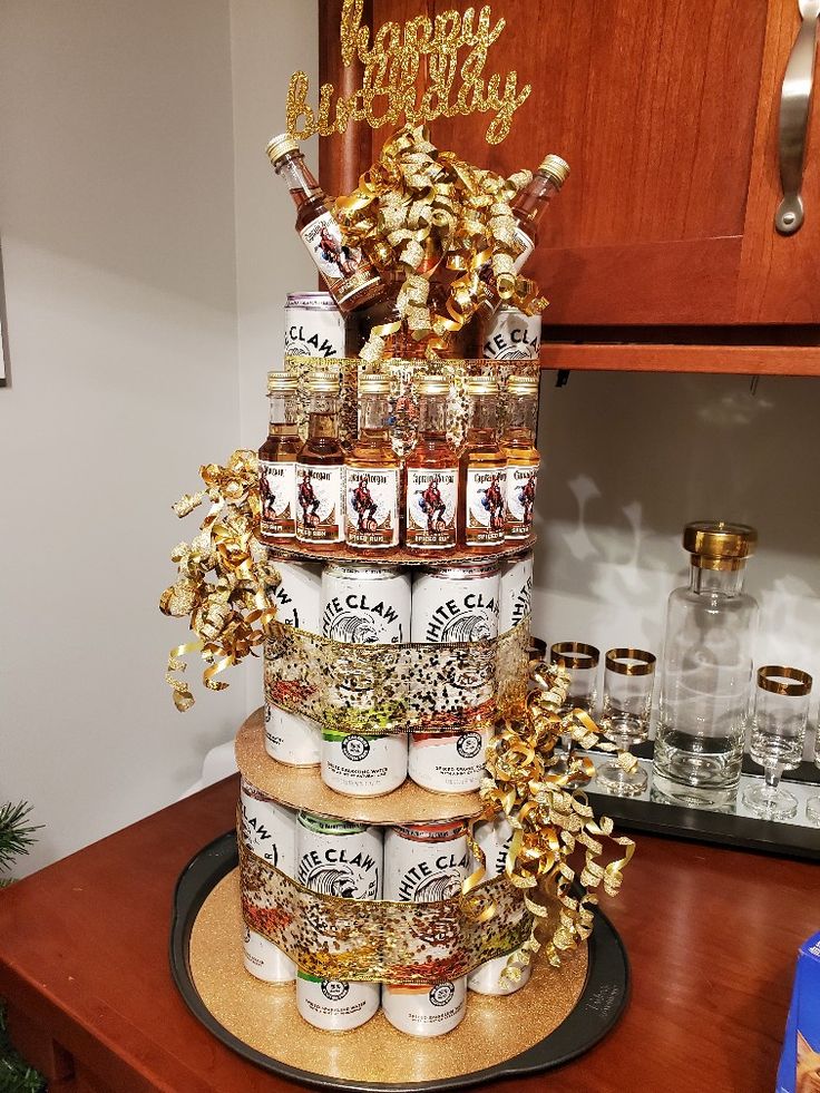 a cake made out of jars and gold decorations