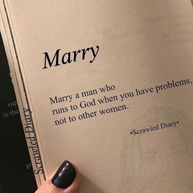 a woman's hand holding an open book with the words, matruity is when you realize your goals are more important than love