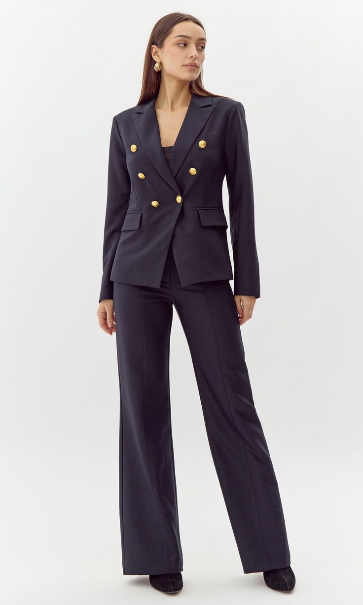 This bold blazer is adorned with gold buttons on the bodice and sleeves. The double-breasted structure also features faux, front pockets and a notched lapel. Can be matched with Colson Trousers. Blazer Double-Breasted Lined Length: 26" Chest: 17 1/4" Self: 77% Polyester, 16% Viscose, 7% Spandex Lining: 97% Polyester, 3% Spandex Hand wash in cold water with similar colors. Model is wearing a size small Style #: G247J1755 Formal Double Breasted Suit With Button Cuffs For Fall, Classic Formal Blazer Dress With Gold Buttons, Classic Blazer Dress With Gold Buttons For Formal Occasions, Business Blazer With Gold Buttons, Long Sleeve, Chic Formal Blazer With Gold Buttons, Double-breasted Business Blazer Dress With Button Cuffs, Long Sleeve Blazer With Gold Buttons For Work, Double-breasted Blazer Dress With Button Cuffs For Business, Double-breasted Blazer Dress For Business Casual