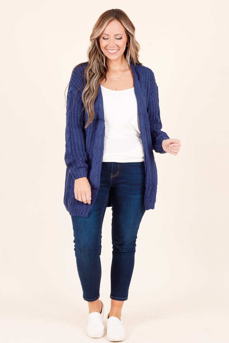 This sassy cardi is an essential layering piece for the season! Crafted from a soft, knitted material in a classic navy hue, you'll enjoy cozy comfort with unmatched style! Perfect for the season, this cardigan makes a great addition to any wardrobe! 100% Acrylic Casual Navy Cardigan For Fall, Trendy Navy Sweater For Fall, Navy Long Sleeve Winter Cardigan, Navy Cardigan For Fall, Trendy Navy Sweater For Winter, Navy Knit Winter Outerwear, Navy Knitted Sweater For Fall, Navy Knit Outerwear For Winter, Navy Sweater For Layering In Fall