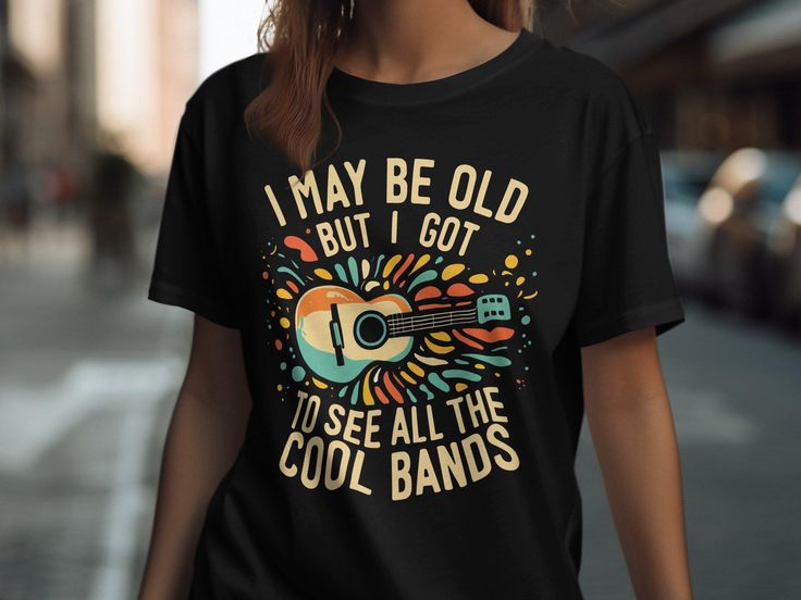 Embrace your love for retro music bands with this "I May Be Old But Got To See All The Cool Bands" design, available on T-Shirts, Tank Tops, Sweatshirts, and Hoodies. Perfect for music enthusiasts and concert lovers, this top is a great addition to any wardrobe. Whether you wear it to a casual outing or a music festival, it's sure to be a hit. Ideal gift for anyone who cherishes the golden days of music. Get yours now and rock the vintage vibes! Unisex T-Shirt: Fabrication: Medium fabric (5.3 oz Cheap Music-themed Shirt For Fans, Concert Top, Funny Music, Golden Days, Sweat Shirts, Music Fans, Retro Music, Vintage Vibes, The Cool