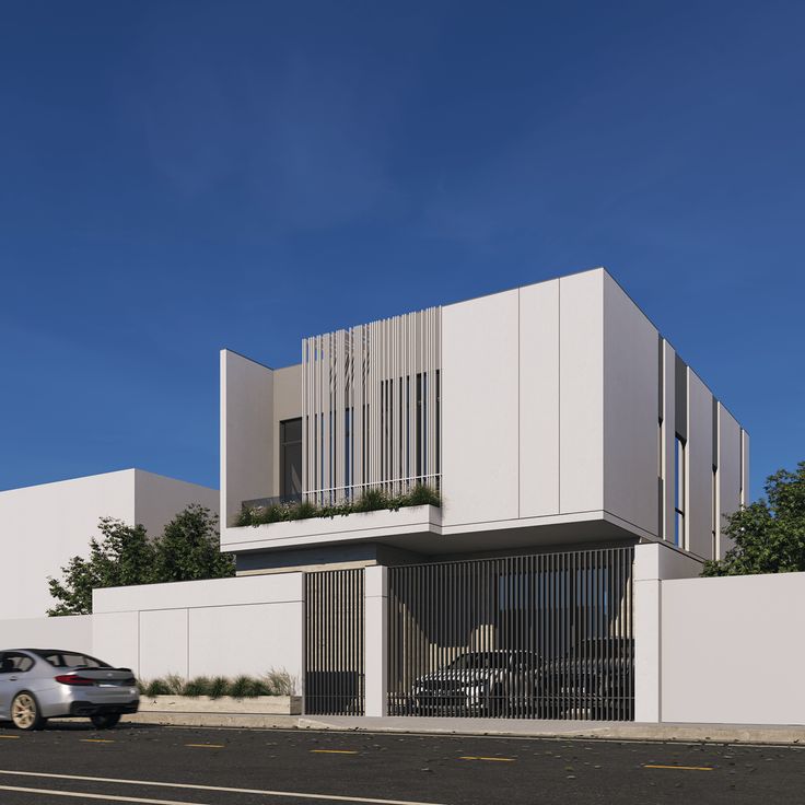 a car parked in front of a white building