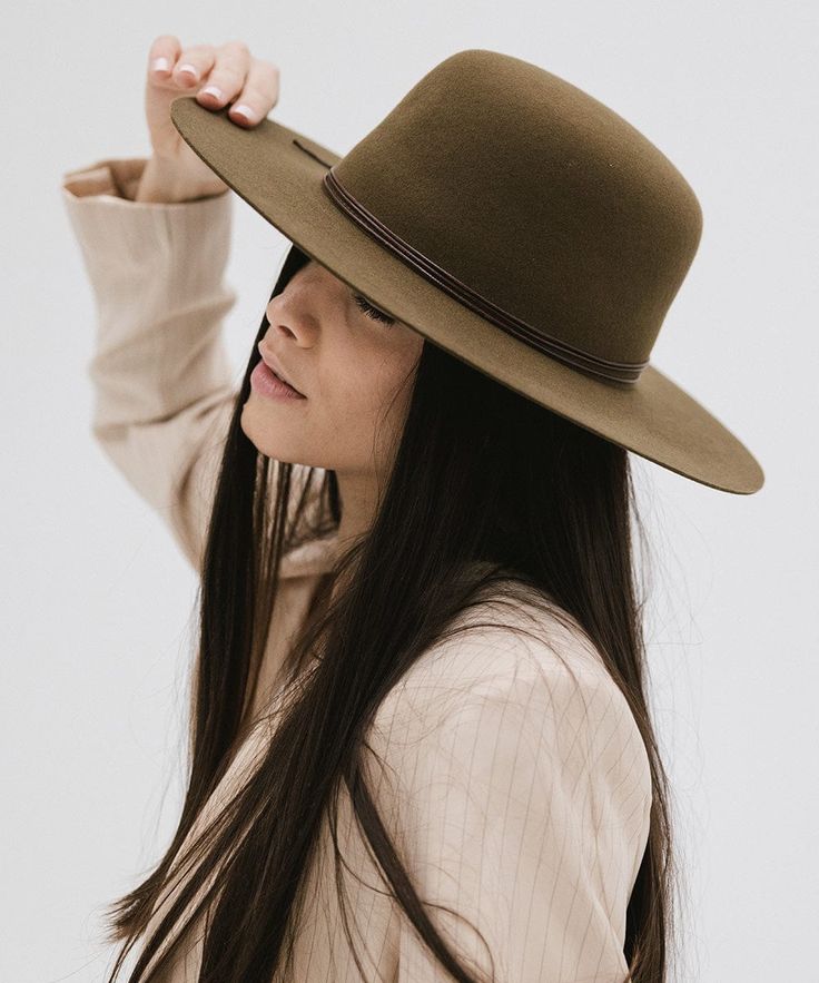 Rue is a sophisticated, classic open crown shape with a structured semi-wide brim. This is the only hat featuring hand-stitched detailing on the brim's edge for a subtle, distinctive touch. Included is a tonal triple-strand waxed leather band that is both adjustable + removable for styling. Classic Brimmed Felt Hat For Everyday, Classic Wide Brim Felt Hat For Everyday, Fitted Flat Crown Hat Bands For Everyday, Classic Wide Brim Boater Hat For Fall, Classic Flat Crown Top Hat For Fall, Classic Top Hat With Flat Crown For Fall, Spring Formal Fedora With Flat Crown, Classic Fall Top Hat With Flat Crown, Classic Unlined Flat Brim Fedora