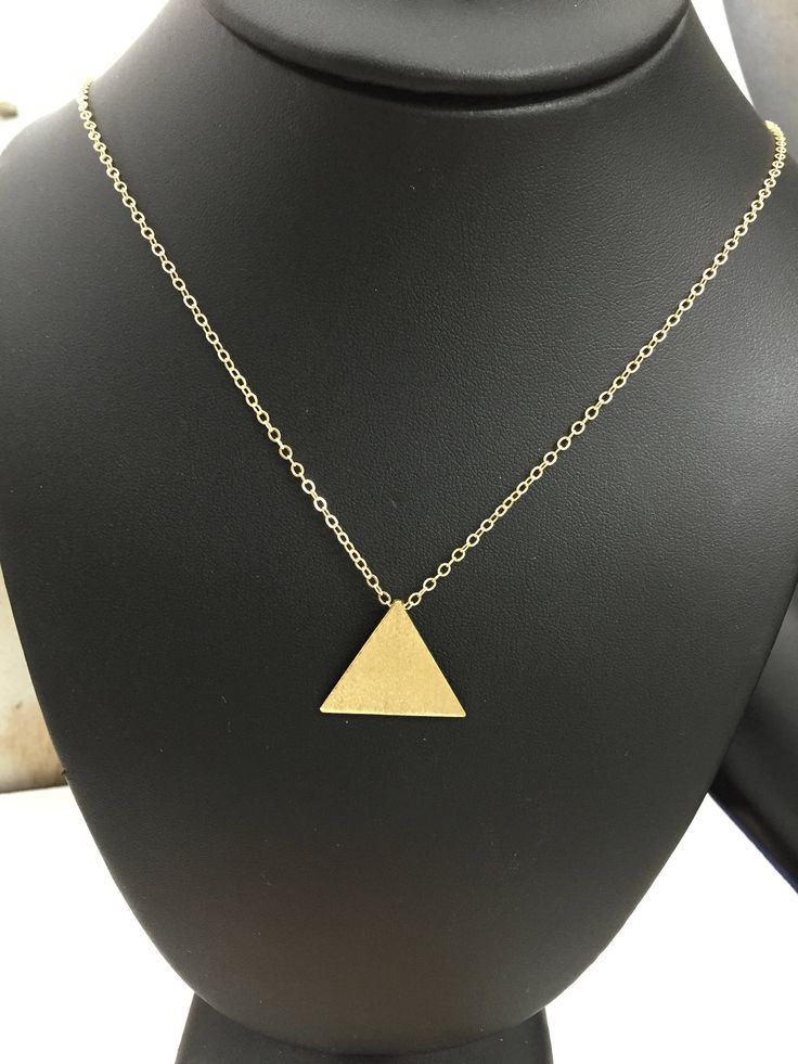 I've designed a Stevie Nicks inspired triangle pyramid pendant necklace like the one she wore in the Rumours era. It's one inch in diameter and I've made from solid sterling silver and then used a 24K gold plating so it has the look of gold, without nearly the same expense! The plating will last if you take care of the necklace, so be mindful not to sleep in it or wear it in the shower or swimming. The chain is gold-filled and will come with a lobster claw for secure attachment. You can choose y Gold Triangle Brass Jewelry, Minimalist Gold Triangle Jewelry, Minimalist Triangle Gold Jewelry, Gold Triangle Necklace For Gift, Pyramid Necklace, Stevie Nicks Style, Triangle Necklace, Crescent Moon Necklace, Felt Bag