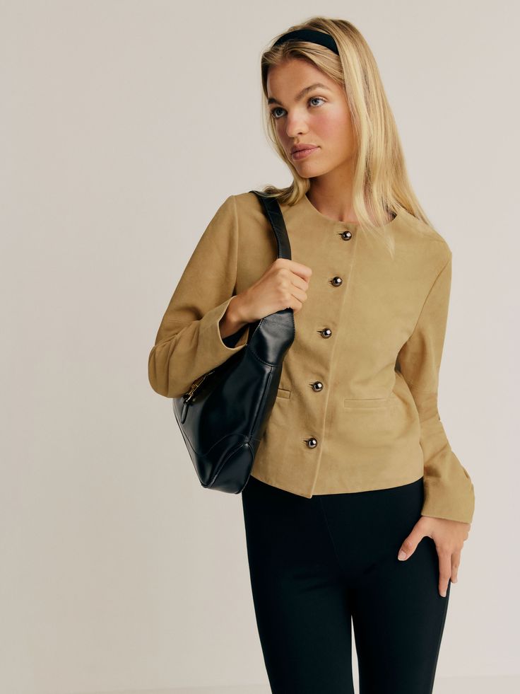 Layer up. Shop the Veda Reed Leather Jacket from Reformation, a collarless jacket with a button front and front pockets. Chic Everyday Blazer With Buttons, Elegant Everyday Blazer With Button Closure, Elegant Everyday Button-up Outerwear, Chic Office Blazer With Stand Collar, Elegant Button-up Outerwear For Everyday, Chic Business Outerwear With Stand Collar, Chic Stand Collar Blazer For Office, Chic Outerwear With Stand Collar For Business, Elegant Fall Leather Jacket With Button Cuffs