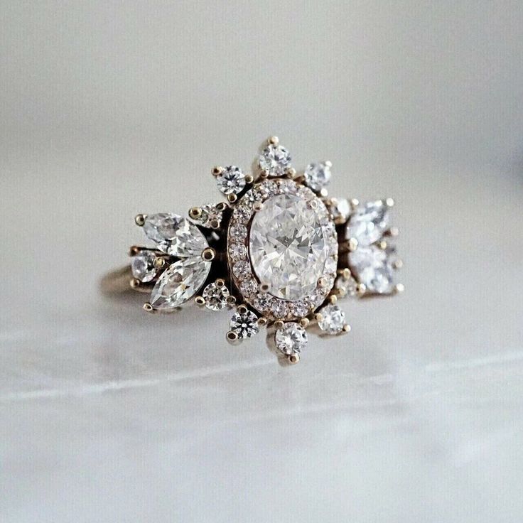 a close up of a ring with diamonds on it's center and side stones in the middle