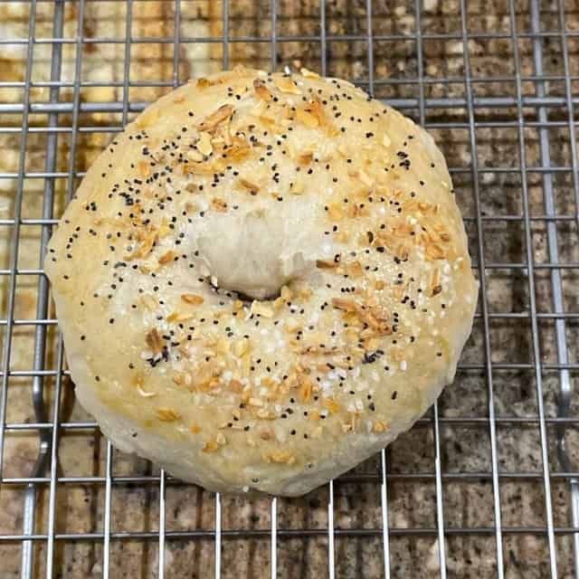 a bagel sitting on top of a cooling rack