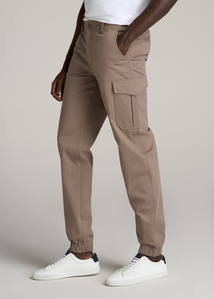 About Our Stretch Cotton Cargo Jogger Pants for Tall Men Looking for a casual pair of slacks for tall men with some stretch? Enter our Cotton Cargo Joggers. As comfortable as your favorite sweatpants but designed with a modern fit, these pants for tall men are easy wearing yet ultra-flattering. They have a mid-rise waist and tapered leg that lands at your ankle, and we made these just for tall guys from 6’3 to 7’1, so you can trust they’re at the right length for you. Each pair has also been pre Cargo Jogger Pants, Mens Casual Outfits Summer, Tall Men, Tall Pants, Chino Jeans, Cargo Joggers, Cargo Pant, Mens Casual, Mens Casual Outfits