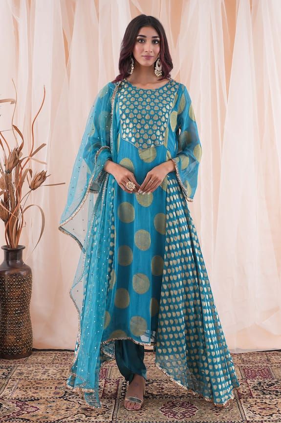 Peacock blue banarasi georgette anarkali with mukaish and cutdana embroidery. Comes with modal satin dhoti pant and a net dupatta. - Aza Fashions Traditional Wear With Self Design In Maxi Length, Traditional Self-design Maxi Length Wear, Unstitched Blue Cotton Silk Sharara, Designer Blue Cutdana Kurta, Designer Banarasi Silk Salwar Kameez With Dupatta, Blue Anarkali Churidar For Festivals, Blue Anarkali Set With Sheer Dupatta And Traditional Drape, Blue Banarasi Silk Sharara With Cutdana Details, Anarkali Palazzo Set With Zari Work