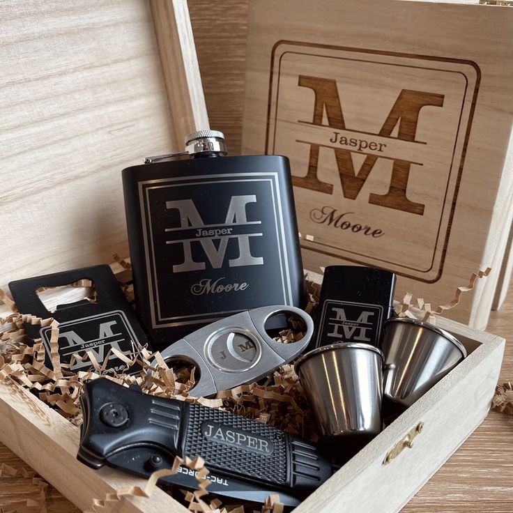 a wooden box filled with lots of different types of liquors and flasks