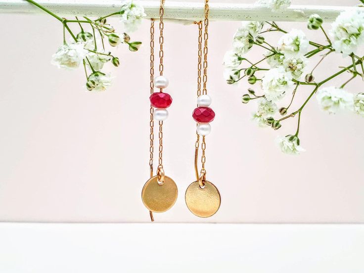 14K goldfield chain earrings, threaded with a beautiful round natural white pearls and with red garnet with a round disk plate. This earrings are the perfect earring jewelry, the round gemstones are beautifully combined together, the goldfield chain is so easy to wear, dainty and delicate. Such a great wedding bridesmaid, bridal or mother of bride gift idea. ✿ Total Earrings length: 12 cm / 4.72' Inch ✿Pearls diameter 0.3 mm / 0.011' Inch, Garnet diameter: 0.5 mm / 0.019' Inch ✿ Round gold-fille Rose Gold Jewelry With Dangling Beads For Gift, Round Delicate Chain Earrings Gift, Rose Gold Dangling Beads Earrings As Gift, Rose Gold Dangling Beads Earrings For Gift, Rose Gold Earrings With Dangling Beads For Gift, Red Garnet Earrings, Earrings Pearl Drop, Disk Earrings, Gold Chain Earrings