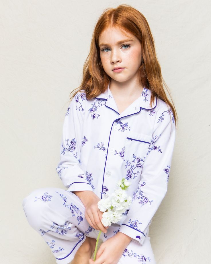 This delicate, vintage print evokes memories of spring mornings and the flowers climbing up the arbors. This classic pajama set is accented with navy piping and finished with pearl buttons. The sleepwear is made from the finest quality cotton and blended with just enough inherently flame retardant fiber to allow it to pass strict CPSC flame retardant laws without using harmful chemicals. The fabric is brushed for added softness, making the sleepwear feel absolutely luxurious, getting cozier afte Classic Long Sleeve Sleepwear For Spring, Classic Cotton Sleepwear For Spring, Classic Sleepwear For Pajama Party In Spring, Classic Spring Sleepwear With Relaxed Fit, White Classic Sleepwear For Spring, Classic Spring Sleepwear For Bedtime, Floral Pajama Set, Indigo Floral, Classic Pajamas