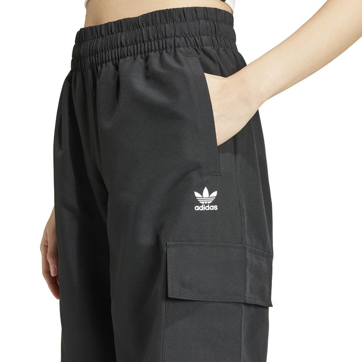 Wide legs make for comfortable days... The adidas Wide Leg Women's Cargo Pants give you plenty of room to move, along with handy cargo pockets to store your belongings. And with the iconic adidas stripes down the side, you can get the comfort and classic style the brand is known for.Features adidas three-stripe design. Relaxed fit. Elastic waistband. Features two cargo pockets. Material: 100% Polyester. Consists of at least 40% recycled materials. Contains 50% Parley Ocean Plastic. Adidas Functional Bottoms For Outdoor Activities, Functional Adidas Bottoms For Outdoor Activities, Adidas Functional Outdoor Bottoms, Adidas Sporty Sweatpants With Pockets, Casual Adidas Sweatpants With Pockets, Adidas Casual Joggers With Pockets, Adidas Athleisure Sweatpants With Pockets, Adidas Joggers With Pockets For Streetwear, Adidas Joggers With Pockets For Sports