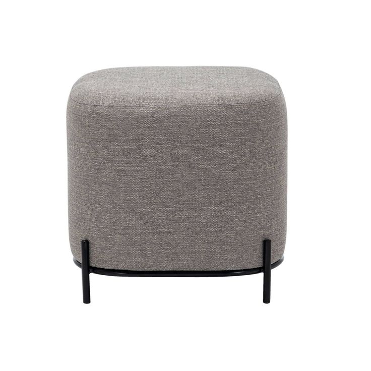 a grey ottoman with black legs and an upholstered foot rest on the side