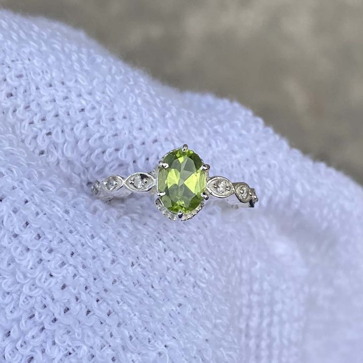 Handmade Product Description Gemstone : Peridot  Stone Size : 6X8 MM Stone Shape : Oval Secondary Stone : Cubic Zirconia Birthstone : August  Gemstone : Cut Ring Size : All Size Available Band Color : Silver Made In Jaipur (INDIA) Payment Policy We accept payment through PayPal Payment should be made within 3 days of purchase. Delivery Time It is Handmade Item So Item will be Shipped within 3 to 5 Days after payment receive. The delivery time usually takes 11 to 24 days, depending which Country & location. We recommend you contact your local customs office if you have questions about this. Feedback If you are not satisfied with your purchased items then contact with us first before leaving negative or neutral feedback or opening disputes. We believe in solving the issues. A positive feedba Oval Green Gemstone Birthstone Ring, Green Oval Sterling Silver Rings, Green Sterling Silver Oval Rings, Green Oval Diamond Ring In Sterling Silver, Oval Lime Green Anniversary Ring, Oval Lime Green Rings For Anniversary, Lime Green Oval Rings For Anniversary, Oval Peridot Birthstone Ring For May, Oval Green Crystal Sterling Silver Ring