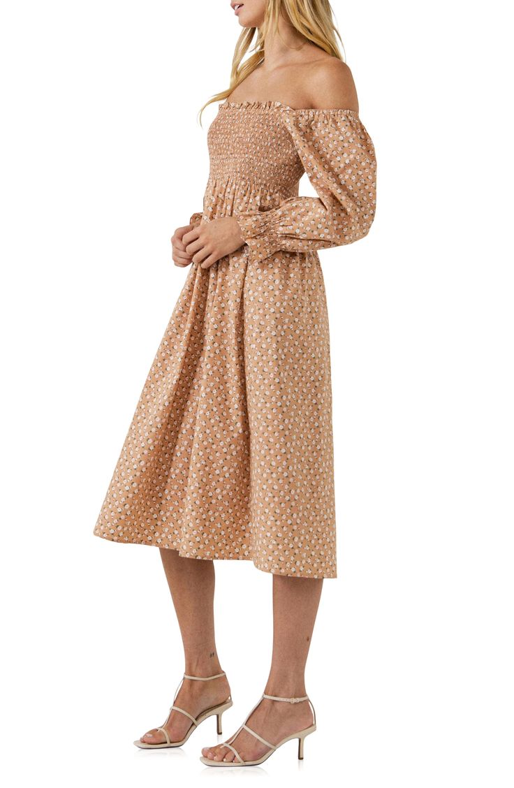 A ditsy floral print covers a muted long-sleeve midi dress with a smocked bodice, blouson sleeves and a twirly skirt. Lined 70% cotton, 27% nylon, 3% spandex Hand wash, dry flat Imported Long Sleeve Smocked Midi Dress For Brunch, Long Sleeve Smocked Top For Fall Brunch, Fitted Long Sleeve Smocked Dress For Daywear, Fitted Long Sleeve Smock Midi Dress, Fitted Smocked Dress With Long Sleeves For Daywear, Fitted Smock Midi Dress With Long Sleeves, Fall Floral Print Smocked Dress For Brunch, Spring Smocked Midi Dress With Ditsy Floral Print, Spring Midi-length Smocked Dress With Elastic Sleeves