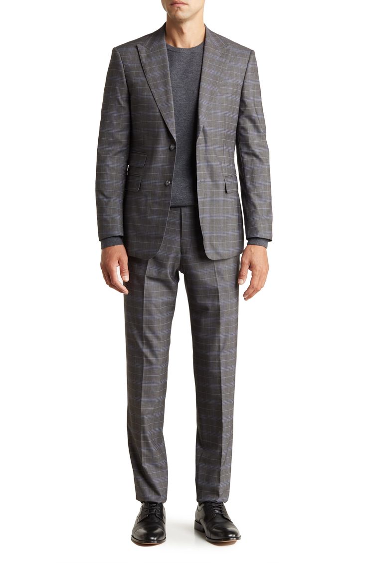 A refined plaid two-button suit cut in a trim silhouette is the perfect go-to for any well-dressed event. 36.4" inseam; 7.8" leg opening; 10.6" rise (size 36) Jacket has peak lapels; chest welt pocket; flap welt pockets
 77% polyester, 21% rayon, 2% spandex Dry clean Imported Model stats: 6'1" height, 32" waist. Model is wearing size 36. Tailored Plaid Suit With Notch Lapel, Timeless Plaid Suit With Notch Lapel, Timeless Plaid Suits With Notch Lapel, Timeless Plaid Suits For Tailoring, Semi-formal Plaid Suit With Notch Lapel, Classic Single-breasted Plaid Suits, Classic Plaid Single-breasted Suits, Fitted Timeless Plaid Suit, Timeless Fitted Plaid Suit