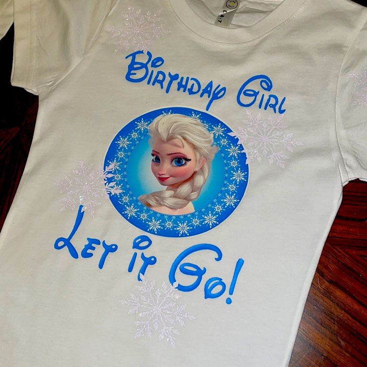 Elsa Birthday Shirt! Girl’s Elsa Birthday Shirt. Front And Back Decorated. All Kids Sizes Available. Message Me With Your Size And I Will Send You A Private Offer With The Size You Want. Customizable White Party Tops, Fun White Top As Gift, Fun White Top As A Gift, Fun Blue Top For First Birthday, Fun White Tops For First Birthday, Fun Blue Tops For Birthday, Cute White Top For Birthday Gift, White Crew Neck Top For Birthday Gift, Playful White Top For Birthday