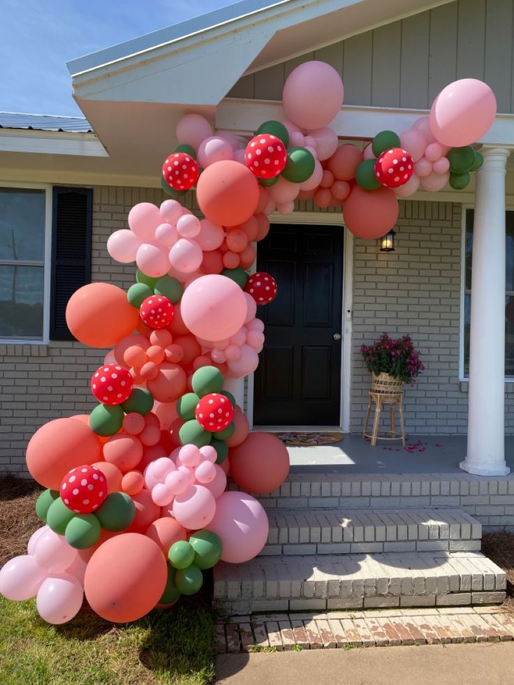 a house decorated with balloons and streamers