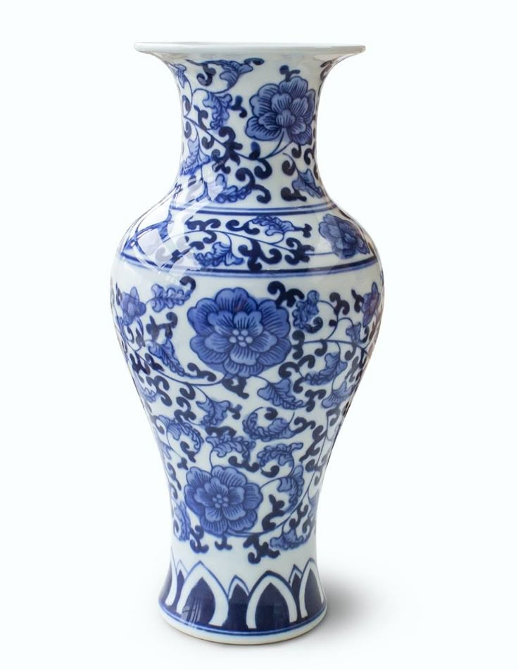 a blue and white vase sitting on top of a table in front of a white background